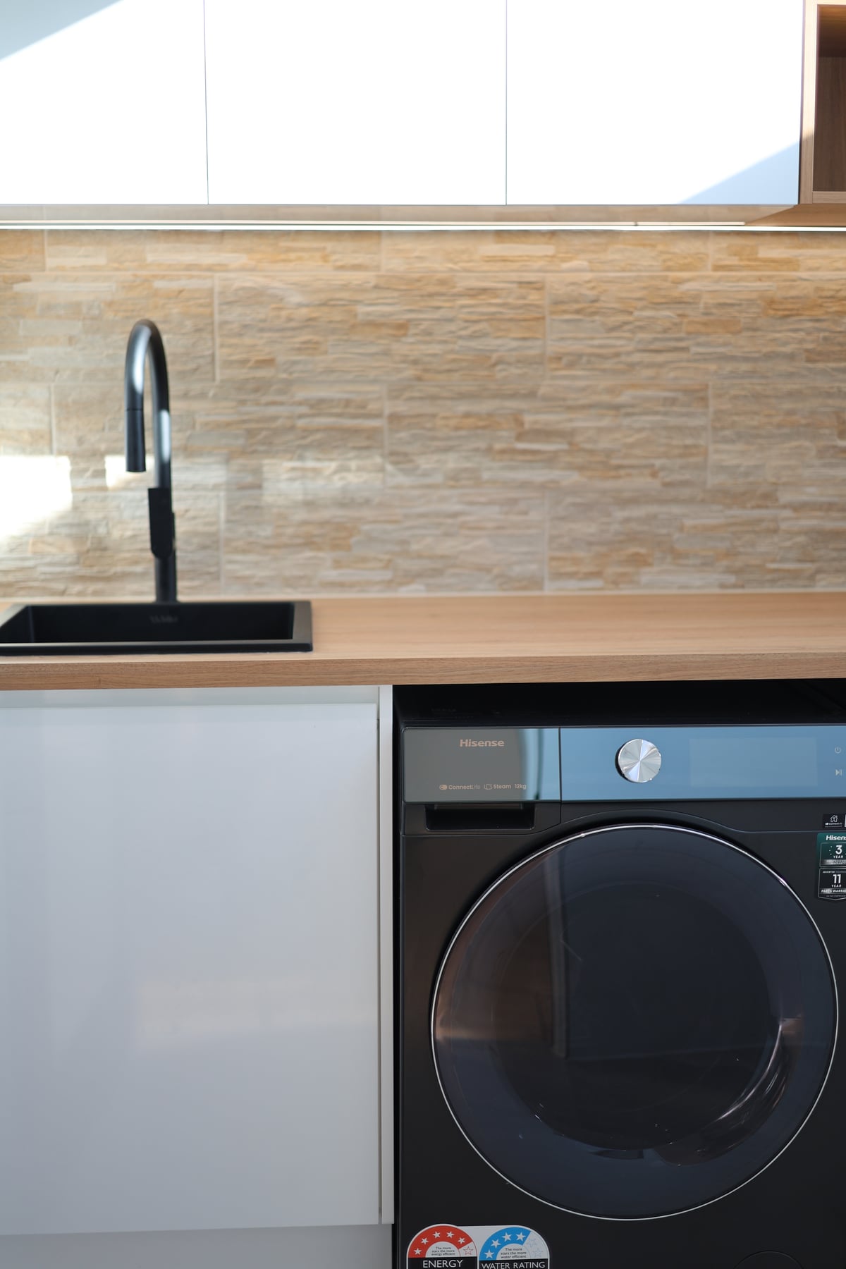 Custom timber joinery niche with feature lighting